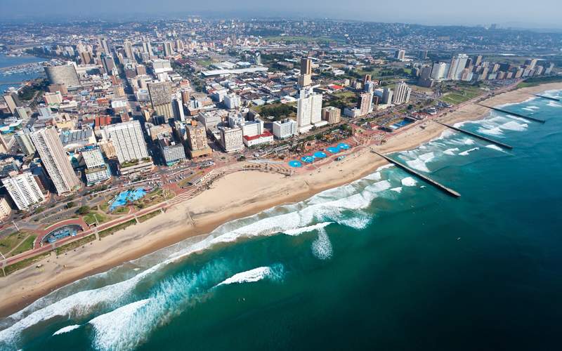Coastal Durban cityscape with palm-lined Umhlanga promenade and tropical gardens