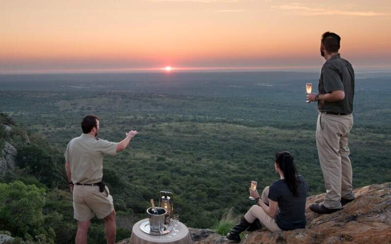 Safari vehicle in the rare sand forest of &Beyond Phinda Private Game Reserve